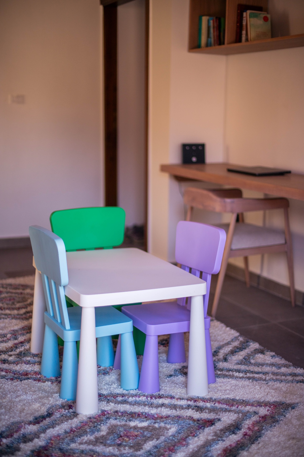 Kids corner with colorful table and chairs