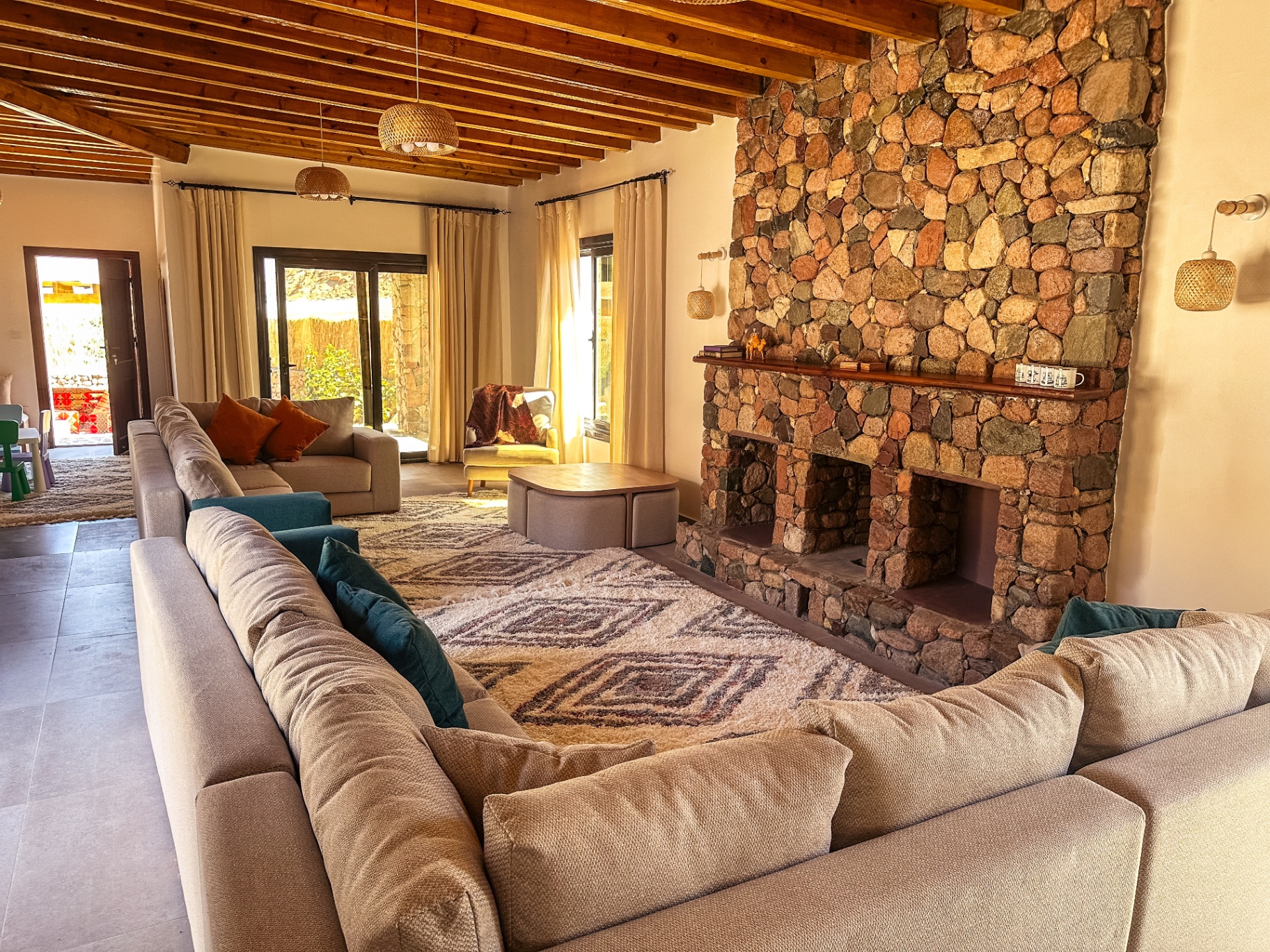 Reception area with stone fireplace and comfortable seating